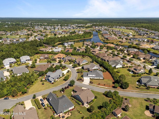 aerial overview of property's location featuring nearby suburban area and a large body of water