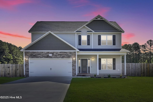 309 Sunrose Dr, Maysville, NC 28555 - craftsman-style house featuring covered porch, driveway, stone siding, and roof with shingles