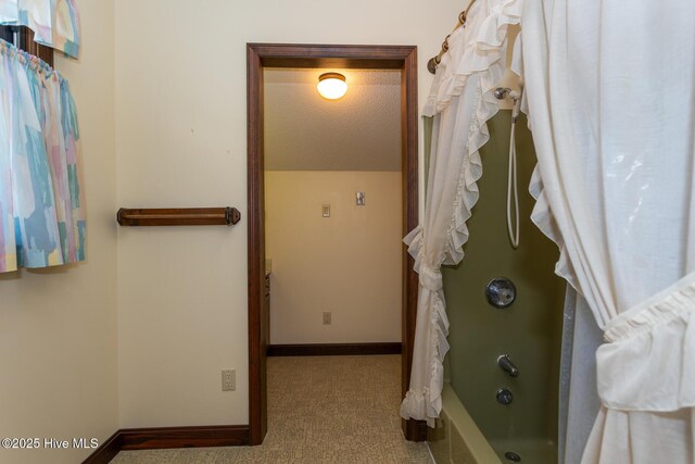 154 Overlook Dr, West End, NC 27376 - unfurnished bedroom with light carpet, two closets, baseboards, and a textured ceiling