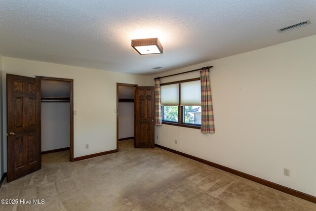 154 Overlook Dr, West End, NC 27376 - unfurnished sunroom featuring a water view, tile patterned flooring, a chandelier, and plenty of natural light