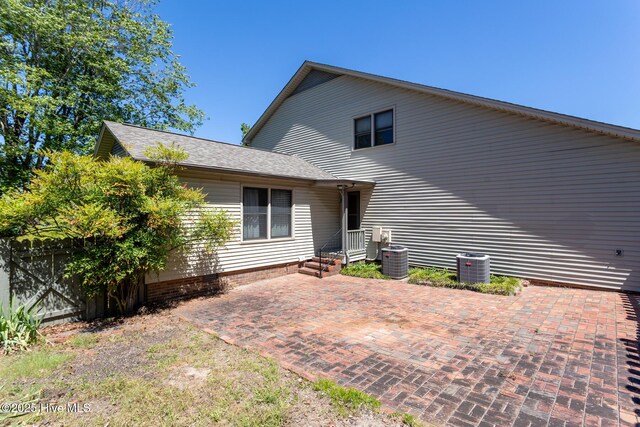 154 Overlook Dr, West End, NC 27376 - back of house with a patio, fence, central air condition unit, and roof with shingles