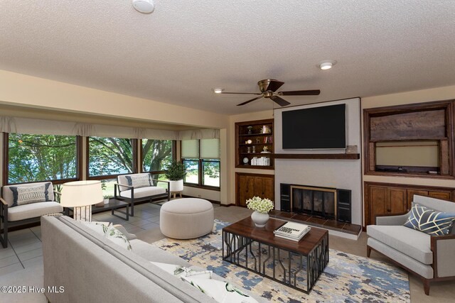 154 Overlook Dr, West End, NC 27376 - unfurnished living room with a ceiling fan, carpet floors, stairway, baseboards, and a textured ceiling