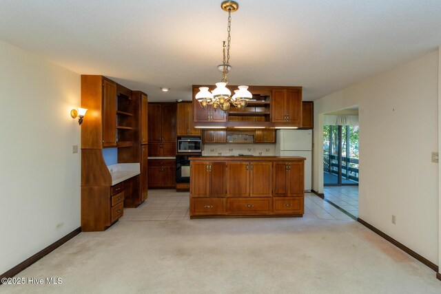 154 Overlook Dr, West End, NC 27376 - kitchen with stainless steel dishwasher, freestanding refrigerator, a sink, tile countertops, and ceiling fan