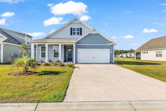 craftsman inspired home with board and batten siding, a garage, a front lawn, concrete driveway, and covered porch