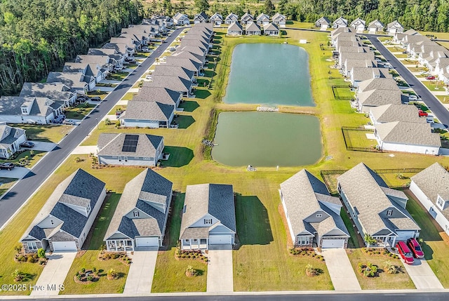 aerial perspective of suburban area featuring a large body of water