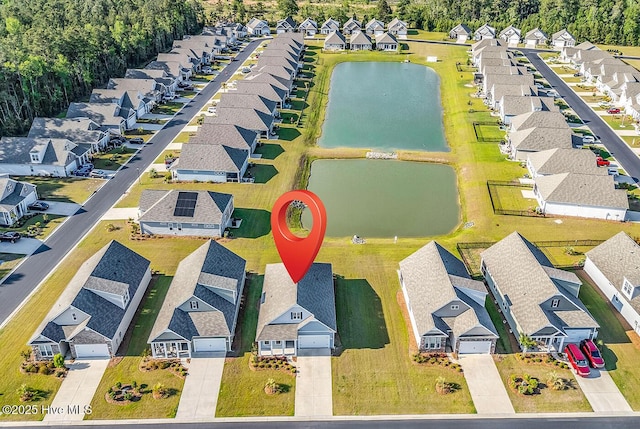 aerial perspective of suburban area featuring a large body of water