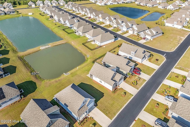 aerial view of residential area with a nearby body of water
