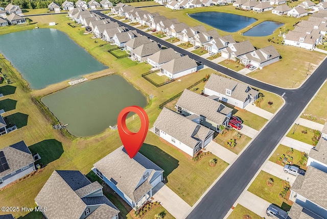 aerial view of residential area with a nearby body of water