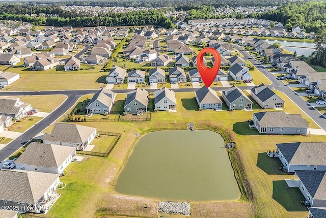 aerial view of residential area with a large body of water