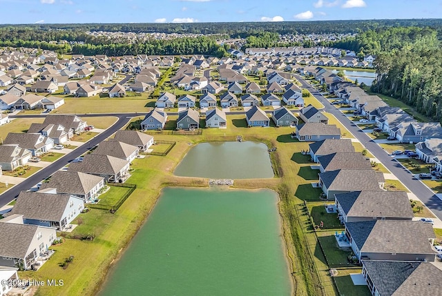 aerial view of residential area with a nearby body of water