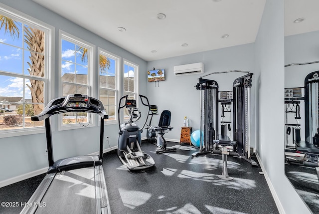 workout area with a wall mounted AC, baseboards, and recessed lighting
