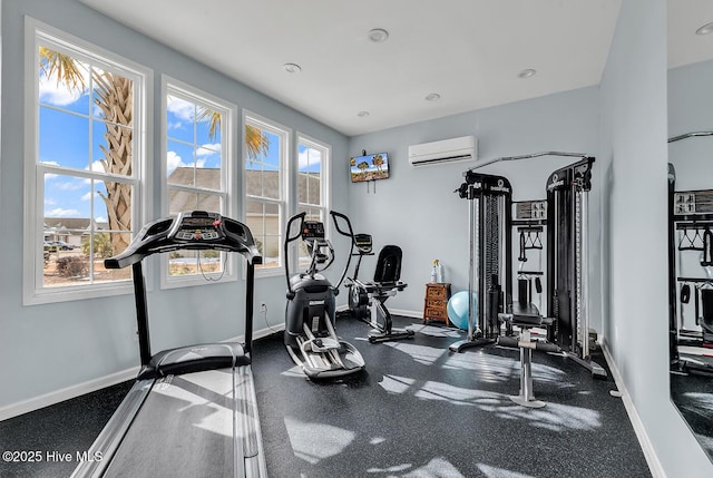 workout area featuring a wall mounted AC, baseboards, and recessed lighting