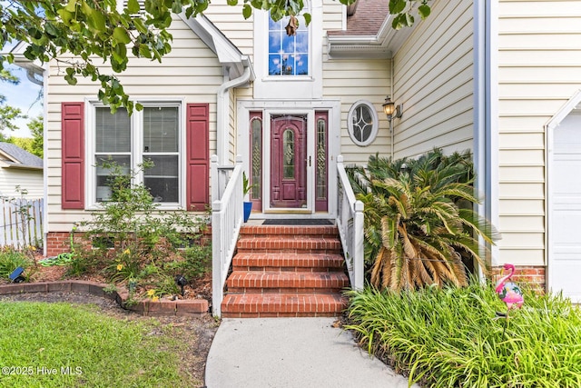 entrance to property featuring fence