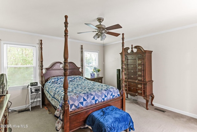 bedroom featuring carpet, baseboards, ornamental molding, and a ceiling fan