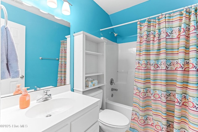 bathroom with toilet, shower / bathtub combination with curtain, and vanity