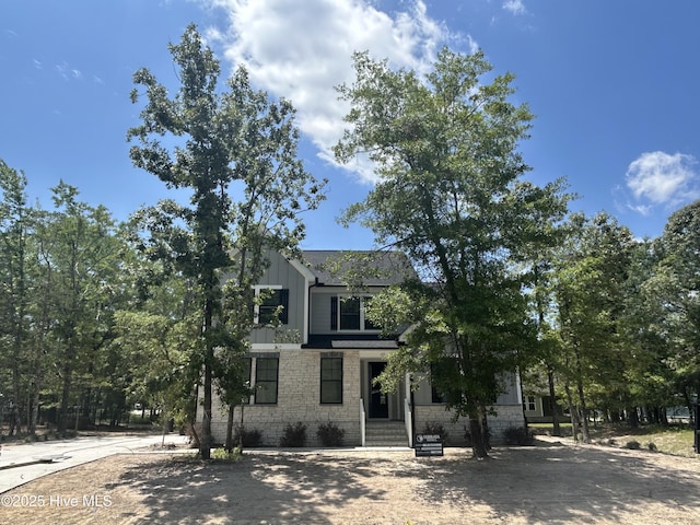 157 Bremerton Dr SE, Bolivia, NC 28422 - view of front of house with board and batten siding and stone siding