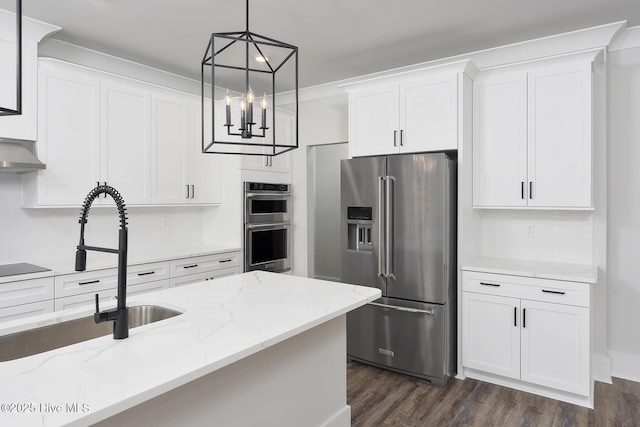 157 Bremerton Dr SE, Bolivia, NC 28422 - kitchen featuring stainless steel appliances, white cabinets, dark wood-type flooring, and decorative light fixtures