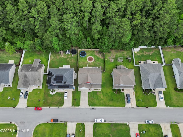 aerial view of property and surrounding area with nearby suburban area