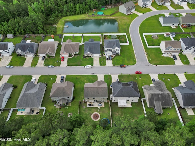 view of property location featuring nearby suburban area and a nearby body of water