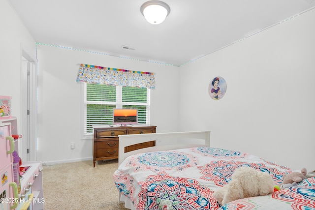 bedroom with carpet floors and baseboards