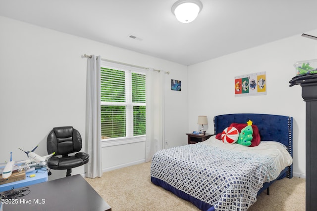carpeted bedroom featuring baseboards