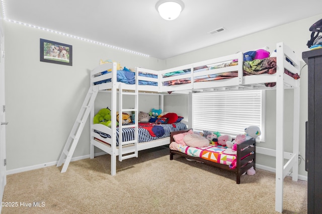 bedroom featuring carpet floors and baseboards