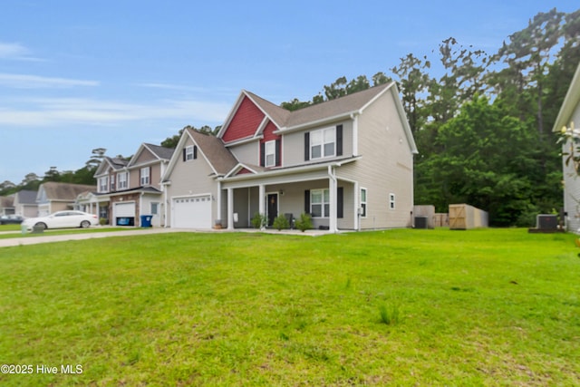 view of front facade featuring covered porch, driveway, a garage, and a front lawn
