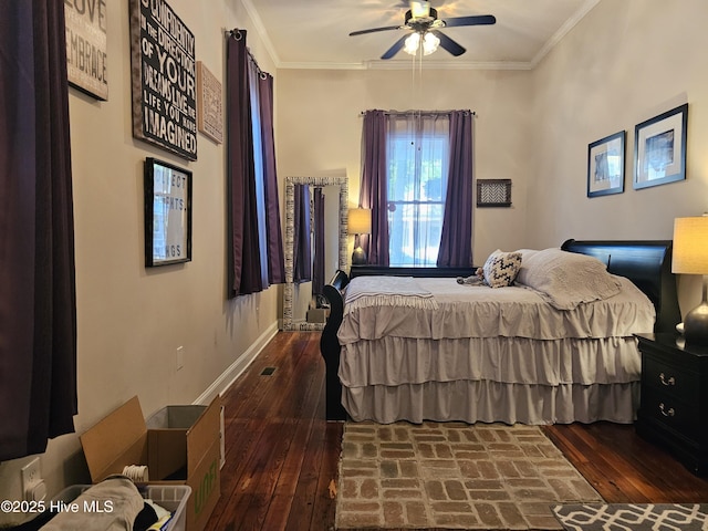 bedroom with crown molding, baseboards, hardwood / wood-style flooring, and a ceiling fan