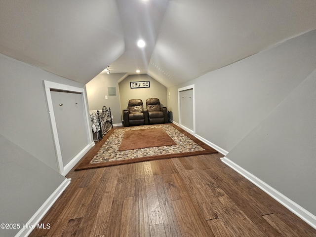 bonus room featuring vaulted ceiling, wood finished floors, and baseboards