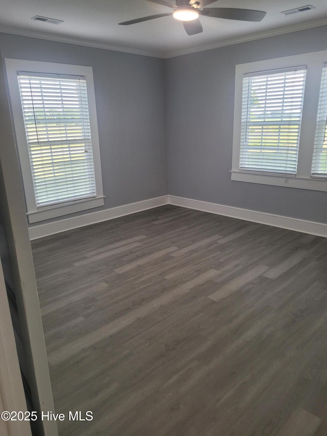 4384 Race Track Rd, Grifton, NC 28530 - unfurnished room with crown molding, a ceiling fan, dark wood-type flooring, and baseboards