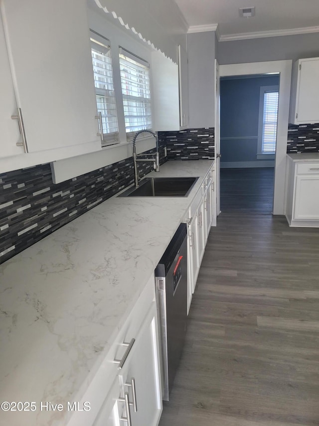 4384 Race Track Rd, Grifton, NC 28530 - kitchen with a sink, stainless steel dishwasher, ornamental molding, tasteful backsplash, and white cabinetry