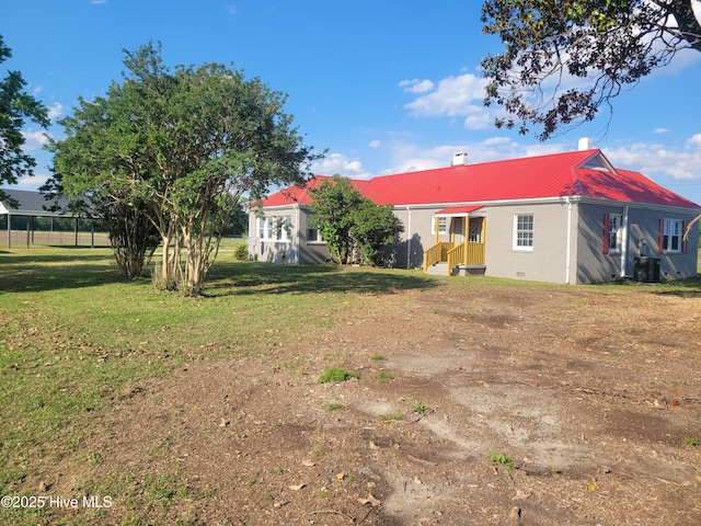 4384 Race Track Rd, Grifton, NC 28530 - rear view of house featuring metal roof, a lawn, and central air condition unit