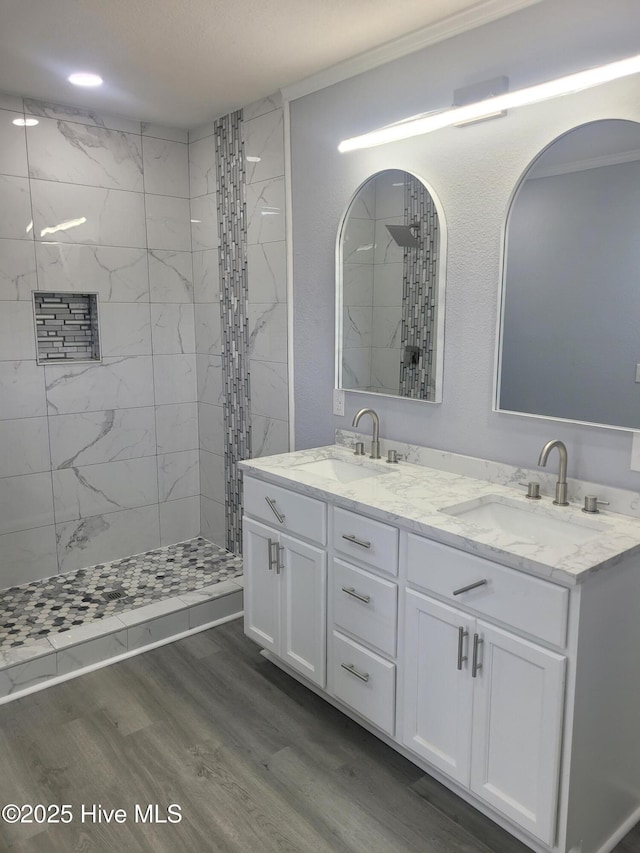 4384 Race Track Rd, Grifton, NC 28530 - bathroom featuring tiled shower, double vanity, and wood finished floors