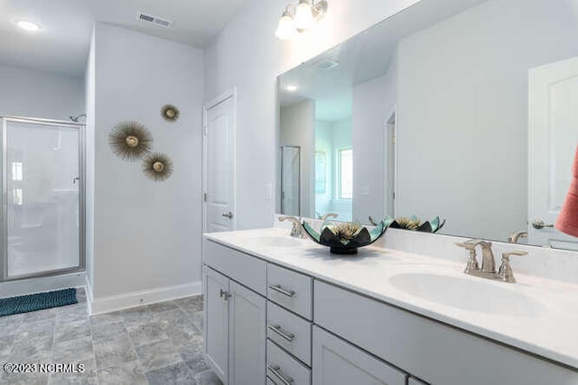 913 Bee Tree Ct, New Bern, NC 28560 - bathroom with a shower stall, baseboards, and double vanity
