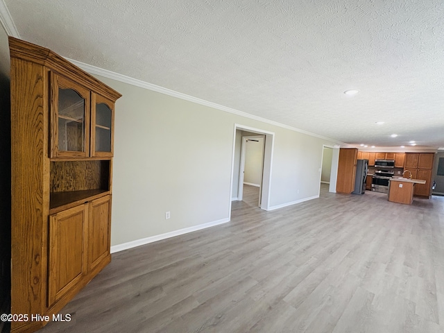 106 Haywood Country Dr, Mount Gilead, NC 27306 - unfurnished living room with baseboards, light wood-style flooring, crown molding, a textured ceiling, and recessed lighting