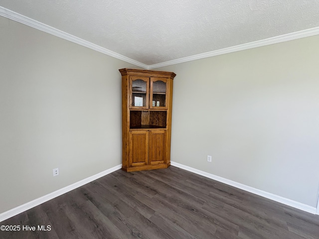 106 Haywood Country Dr, Mount Gilead, NC 27306 - spare room with dark wood-style flooring, crown molding, and baseboards