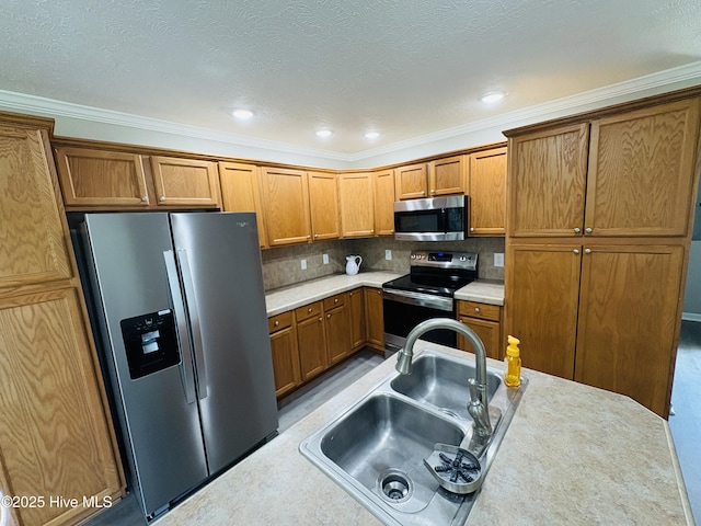 106 Haywood Country Dr, Mount Gilead, NC 27306 - kitchen with stainless steel appliances, a sink, brown cabinets, light countertops, and recessed lighting