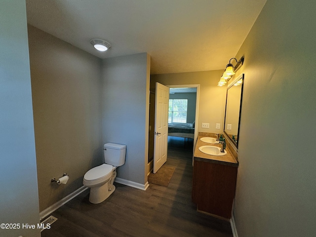 106 Haywood Country Dr, Mount Gilead, NC 27306 - bathroom with toilet, wood finished floors, vanity, and baseboards