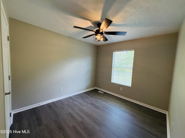 106 Haywood Country Dr, Mount Gilead, NC 27306 - unfurnished room featuring dark wood-style floors, a ceiling fan, baseboards, and a textured ceiling