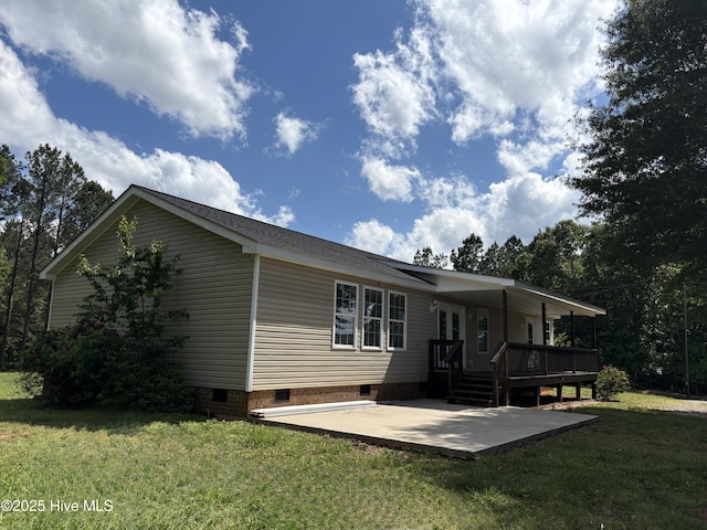 106 Haywood Country Dr, Mount Gilead, NC 27306 - rear view of property with crawl space, a patio area, a lawn, and a wooden deck