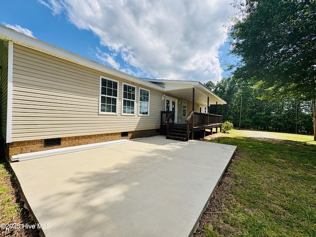 106 Haywood Country Dr, Mount Gilead, NC 27306 - view of side of home featuring crawl space, a yard, a patio, and a deck