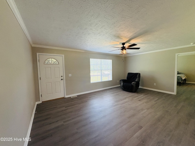106 Haywood Country Dr, Mount Gilead, NC 27306 - entryway featuring dark wood-style floors, a textured ceiling, ceiling fan, baseboards, and ornamental molding