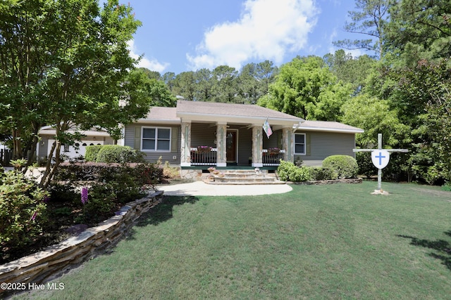 view of front facade with covered porch and a front lawn