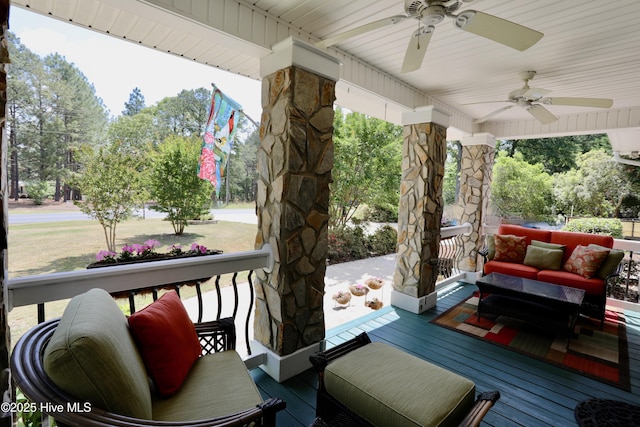 wooden deck with ceiling fan