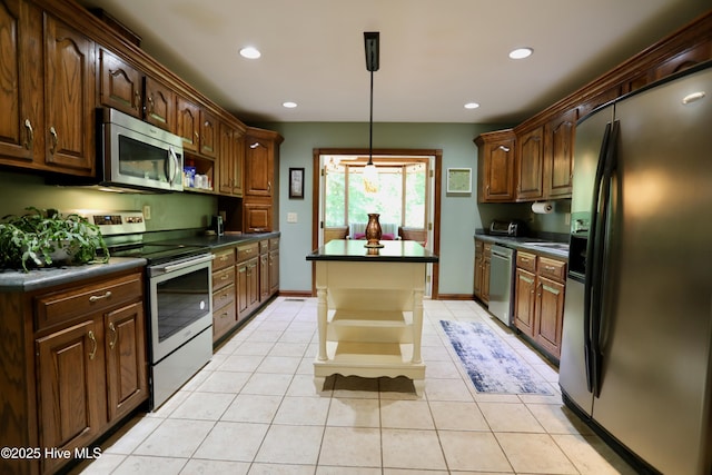 kitchen featuring stainless steel appliances, dark countertops, a center island, open shelves, and recessed lighting