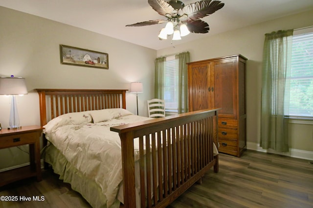 bedroom featuring wood finished floors, ceiling fan, and baseboards