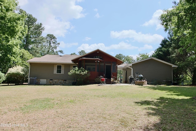 view of front of home featuring a front yard and central air condition unit