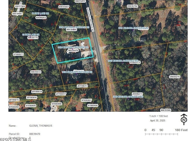 aerial map of property and surrounding area featuring property parcel outlined