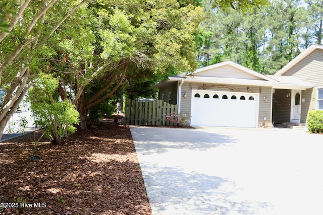 view of front of house with a garage and concrete driveway
