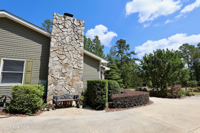 view of home's exterior with a chimney
